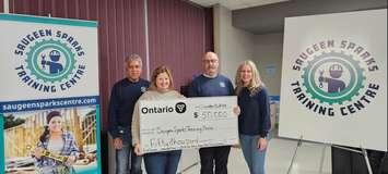 MPP Lisa Thompson presenting the cheque to (from left) Training Centre Executive Director Rob Stanley, Chairman Kenny Kilday, and Board member Lori Kohl. Photo from Rob Stanley