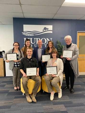 Back row: (From left) Winona Sangster (Bailey) of B Creative Frames, Prints and Design, Paige Havercamp of Boundary Roasting Co., Huron County Warden Glen McNeil, Hannah Uyl of Hopewell Counselling Services, Maureen Cole of We-R-Strategic.
Front row: Arend Havercamp of Boundary Roasting Co., Tanya Merner of TM Marketing Solutions.  Missing from the photo is Hailey McCann of Duck Duck Juice and Gym. (Photo courtesy of  Huron County)