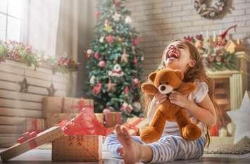 Girl opening Christmas gift
