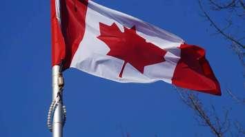 Canadian Flag at a Remembrance Day ceremony 2015. (BlackburnNews.com File Photo).