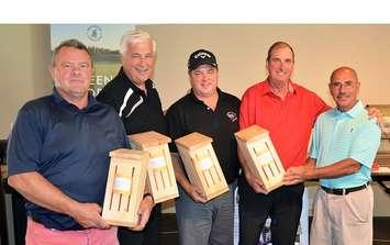 The winning team at the 12th South Huron Trail Fundraiser Golf Tournament, held at Ironwood Golf Club east of Exeter, on August 28, 2017 was (from left to right) Steve Thomas; Jim DeBlock; Craig Hebert; and Bob Illman.   They are shown accepting butterfly box prizes from Dave Crockett, Vice Chair, Ausable Bayfield Conservation Foundation. (Bob Montgomery photo) 