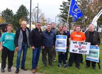 OFL President Chris Buckley (third from left) joins picketers and supporters in front of Georgian College in Owen Sound Monday. (Kirk Scott photo) 
