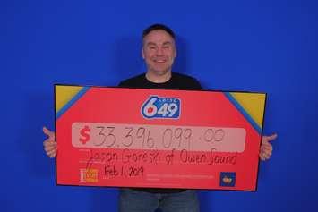 Jason Goreski of Owen Sound and his big cheque. (OLG submitted photo)