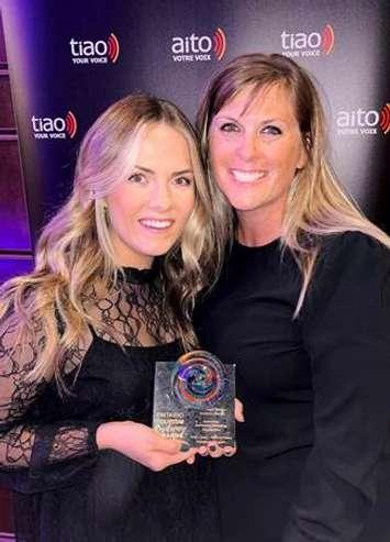 Ashley Lansink, Tourism Officer, and Meredith Forget, Manager of Economic Development and Tourism accepting a Tourism Industry Association of Ontario Tourism Resiliency Award for their Discover More Adventures program at the Ontario Tourism Summit. October 26, 2022 (Photo provided by Perth County)

 