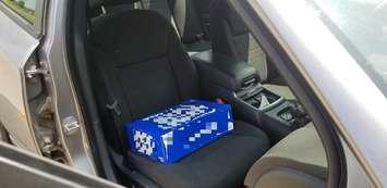Beer case booster seat leads to charges