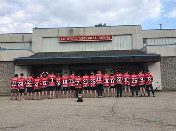 The Listowel Cyclones stand in front of the old Listowel Memorial Arena, with their new Sutherland Cup Trophy taking centre stage. (Photo courtesy of Nancy Anderson)