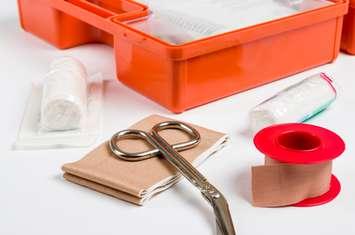 First aid kit with dressing material © Can Stock Photo / zerbor