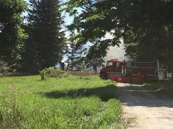 North Huron fire fighters fight the remainder of a blaze that destroyed an abandoned home on Currie Line, just North of Blyth. August 13th, 2018 (Photo by Ryan Drury)