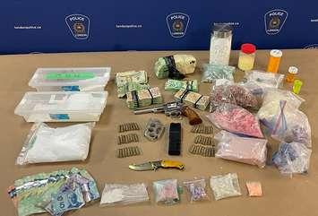 Drugs, weapons, and cash seized by London police during a search of a Hamilton Road home, August 30, 2023. Photo provided by London police