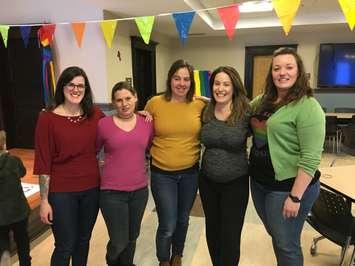 From left to right: Minto Pride committee members Rosie Krul, Raissa Rogers, Caitlin Hall, Samantha Greer and Jess Rowden at the inaugural "Winter Rainbow Social" at the Harriston Library. February 15th, 2020 (Photo by Ryan Drury)