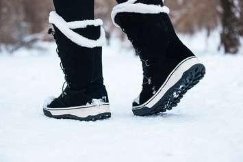 File photo of person walking in the snow courtesy of © Can Stock Photo / AMBERLIGHTPHOTO