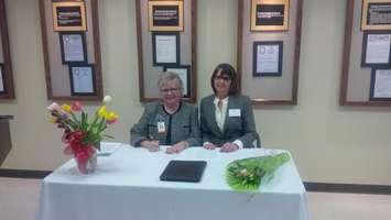 CEO of AMGH Karen Davis (left) with                             Gateway president Gwen Devereaux                                    .(Photo by Bob Montgomery)