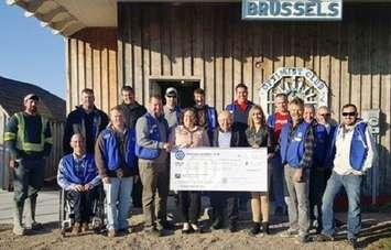 Brussels Optimist Club President Corey Campbell (centre) with representatives from Clinton, Seaforth and Wingham Hospital Foundations and other Optimist Club members.  (photo submitted) 