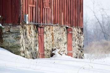Close up of a red barn in winter. © Can Stock Photo / tfawls