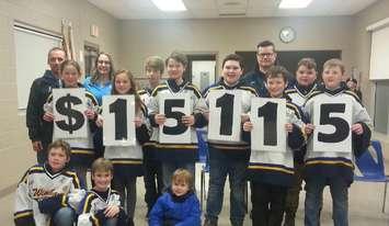 The Wingham Peewee Local League team, proudly displaying their total that they raised toward the Juvenile Diabetes Research Fund for their entry in the Good Deeds Cup. Back row: Scott McPherson ,Nichola Cozad JDRF , Kirkton Curtis, Coach Rob Harrison,  Aiden McKee

Middle: Alyn Wheeler ,Leah Sangster, Austin Bieman, Landon Brewer, Jack Harrison, Nic Clark

Front: Ryder Robinson, Colban Herd, Andrew Wheeler (Photo submitted by Desiree Riley)