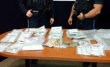 Wellington County OPP display the drugs and cash seized from a motel room in Guelph on December 31st. (photo submitted by Wellington County OPP)