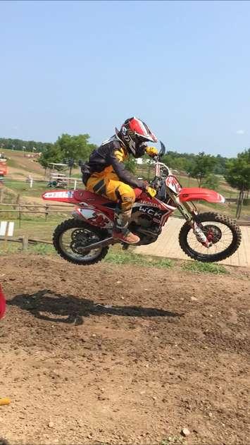 An amateur rider catching some air during practice at the 2018 Canadian Motocross Grand National Championship at Walton Raceway. Tuesday, August 14th, 2018 (Photo by Ryan Drury)
