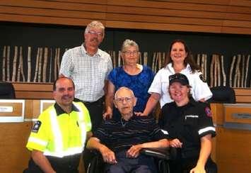 Back Row from left: Tom Garland, Shirley Garland, Communications Officer Tracey White.  Front Row: Paramedic Dennis Mengotto, Donald Garland, Paramedic Sara Pickard (photo by Kirk Scott) 