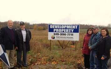 Members of Penetangore Regional Economic Development Corporation at
the foot of a piece of property they are looking to develop in
Kincardine. Left to right, Jim Prenger [President], Ron Coristine
[Executive Director], Linda Bowers [Secretary-Treasurer], Bob Cottrill
[Vice-President] and Linda Munro [Executive Assistant] 