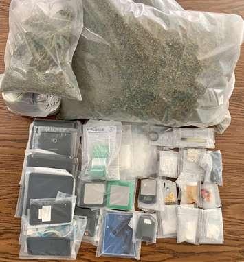 Seized drugs and property (Image courtesy of the Ontario Provincial Police)