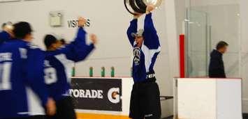 Ryan Merkley of team GTHL Blue hoists the 2016 OHL Gold Cup trophy, helping his team beat Alliance Hockey 6-1 in the final. (Photo courtesy of the Ontario Hockey Federation.)