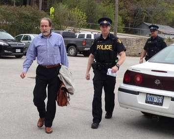 South Bruce Peninsula Councillor Craig Gammie [Left] is escorted from town
hall by OPP officers in May 2015.
Photo by Jordan MacKinnon.