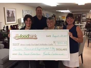 (Left to right) RaeAnn Ladouceur, Sales Manager at Forever Furniture; Tom Williscraft, Blackburn Radio; Mary Ellen Zilman, Executive Director at Huron County Foodbank; and Pauline Tail, Board Member at Huron County Foodbank present a cheque to the Huron County Foodbank. (photo submitted)