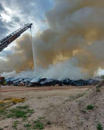 Firefighters working on a large garbage fire at a landfill on Grey Road 3. May 11, 2022. (Photo via West Grey Police Service.)