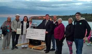 Bruce-Grey Owen Sound MPP Bill Walker joins others at the Peninsula Observation Deck for a cheque presentation and to take part in the Bruce Peninsula Biosphere Association’s Bayside Astronomy Program.  (photo submitted) 