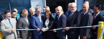 Cutting the ribbon is the Honourable Glen Murray, Minister of Environment and Climate Change, and Cara Clairman, Plug ’n Drive’s President and CEO. 
Mike Rencheck, Bruce Power President and CEO is second from right.  (photo submitted) 