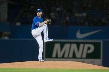 Toronto Blue Jays starting pitcher J.A. Happ works against the Oakland Athletics during the first inning of a baseball game in Toronto on Saturday, April 23, 2016. (Chris Young/The Canadian Press via AP) MANDATORY CREDIT