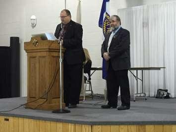Morris Turnberry Mayor Paul Gowing, at podium, and North Huron Reeve Neil Vincent announce the partnership to share public service deliveries on February 9th, 2016.