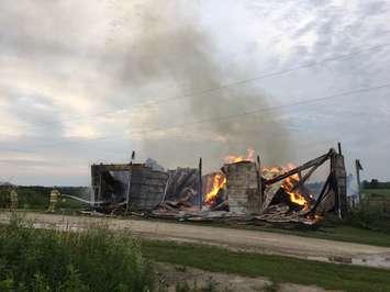 A barn is fully engulfed on Sideroad 27, Town of Erin on July 20, 2017.  (Photo courtesy of the OPP)