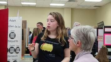 Bethany Gunn explaining her project at the school science fair in Owen Sound. (Photo by Kirk Scott)
