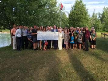 The "Our Hospital, Our Future" campaign, along with many community guests, pose with the $4.5 million dollar cheque from funds raised to help the Wingham Hospital Renovations. They held a celebratory party at the Wingham Sportsman's Association, July 21st, 2016. (Photo by Ryan Drury)