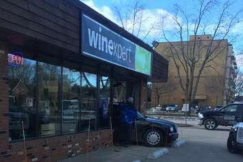 Emergency crews respond to 10th Street W in Owen Sound after a car crashed in to the Winexpert's storefront, December 18, 2018. (Photo courtesy of Heather Gibbons)