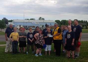 Goderich Lions Club President Gary Blenkhorn presents cheque to Special Olympics Tuesday (photo by Bob Montgomery)
