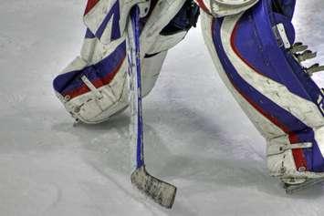 Close-up of a goaltender in a defensive position. © Can Stock Photo / dbriyul