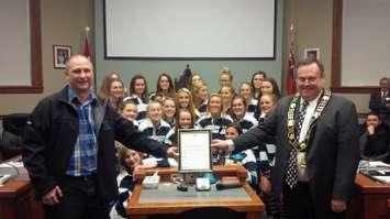 Goderich Vikings Field Hockey team honoured by Goderich Council. Coach Ray Lewis is on the left, and Mayor Kevin Morrison on the right.
Photo by Bob Montgomery