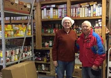 Bill Cunningham and Roland Bernier, two of the many volunteers at the Port Elgin Food Bank, welcomed Bruce Power’s annual donation.   (photo submitted) 