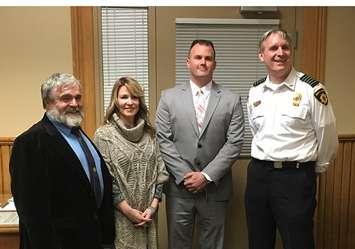 Left to Right: North Huron Reeve Neil Vincent, CAO Sharon Chambers, new North Huron Fire Chief Ryan Ladner, and outgoing Chief David Sparling. (photo by Ryan Drury)
