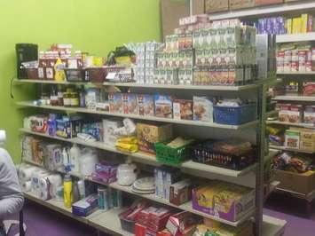 Community donations refill the bare shelves at the Exeter Foodbank