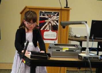 Linda Cotter reads her award winning poem at a Bluewater District School Board meeting.
Photo by Kirk Scott