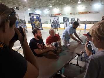 St. Louis Blues star Ryan O'Reilly signs autographs for fans at the Bayfield Arena. Photo by Bob Montgomery.