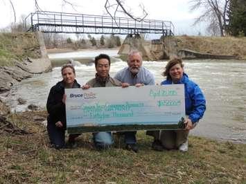 The photo of the $45,000 donation was taken at the Lockerby Dam near Paisley. In the photo is Cherie-Lee Fietsch, left, Environmental Scientist, Environment Programs, Bruce Power; Francis Chua, Manager, Environment & Sustainability, Bruce Power; Wayne Brohman, General Manager, SVCA; and Jo-Anne Harbinson, Manager, Water Resources and Stewardship Services, SVCA.