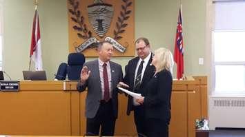 Central Huron mayor Jim Ginn accepts Warden's position with 2016 Warden, Paul Gowing, looking on. (Photo by Craig Power)