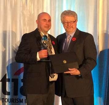 Bruce County Warden Mitch Twolan (left) accepts the Tourism Marketing Campaign Award at the 2015 Ontario Tourism Summit in Toronto.
[photo submitted)