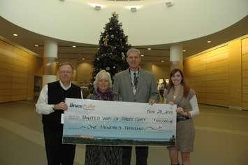 Harry Hall, Vice-President, Supply Chain, left, and Crystal Shepherd, Personal Assistant, right, present a cheque for $100,000 to United Way of Bruce Grey.  Accepting the donation on behalf of United Way of Bruce Grey are Francesca Dobbyn, Executive Director, and Dave Myette, a Bruce Power employee and Chairman of the Board of Directors for United Way of Bruce Grey.  (Submitted photo)