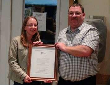 Amy Kieffer receives the Community Activist of the Year Award from Grey Bruce Labour Council President Kevin Smith.