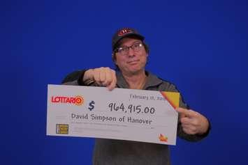 David Simpson of Hanover picks up his winnings in Toronto. (Photo courtesy of OLG)